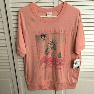 Brand New LuLaRoe pink top w/Statue of Liberty logo; Size: M